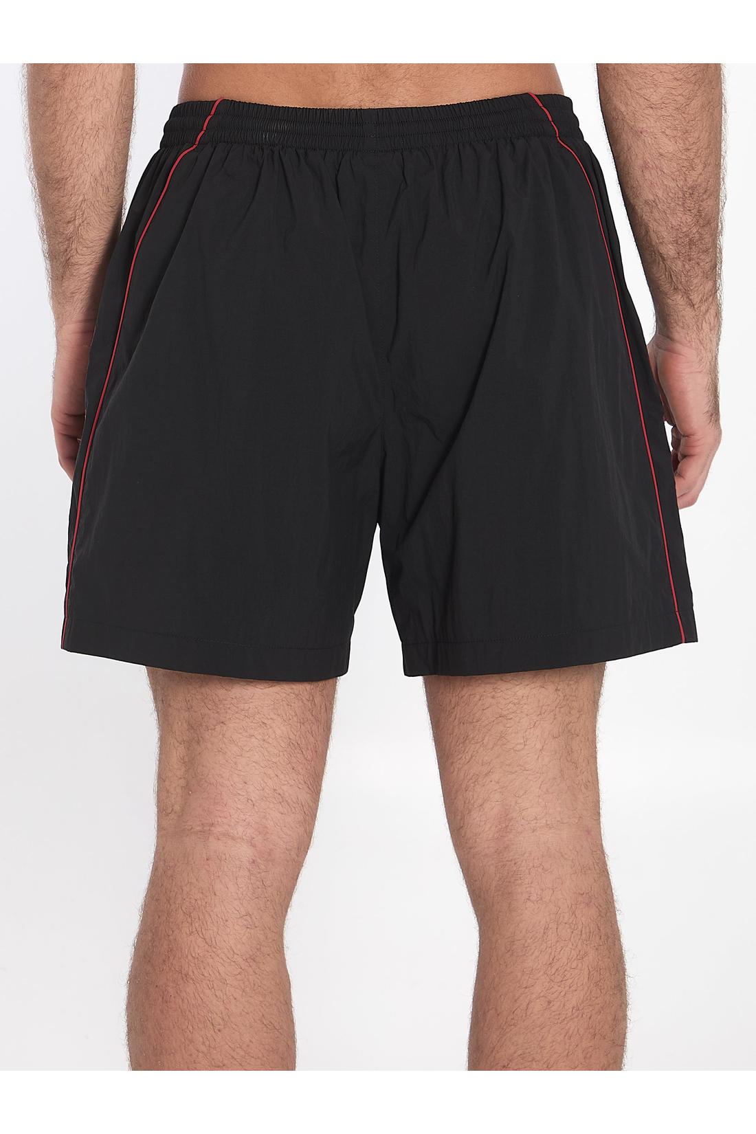 Bermuda shorts with red logo