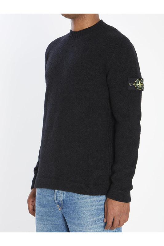 Crew neck sweater with brushed texture.