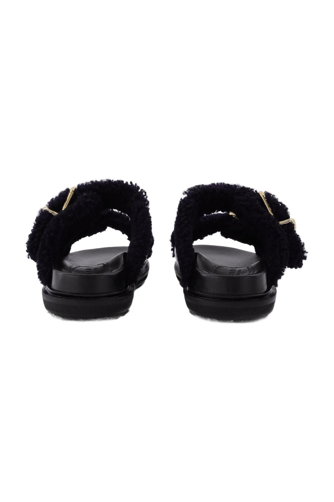 Slides Fussbett aus schwarzem Leder