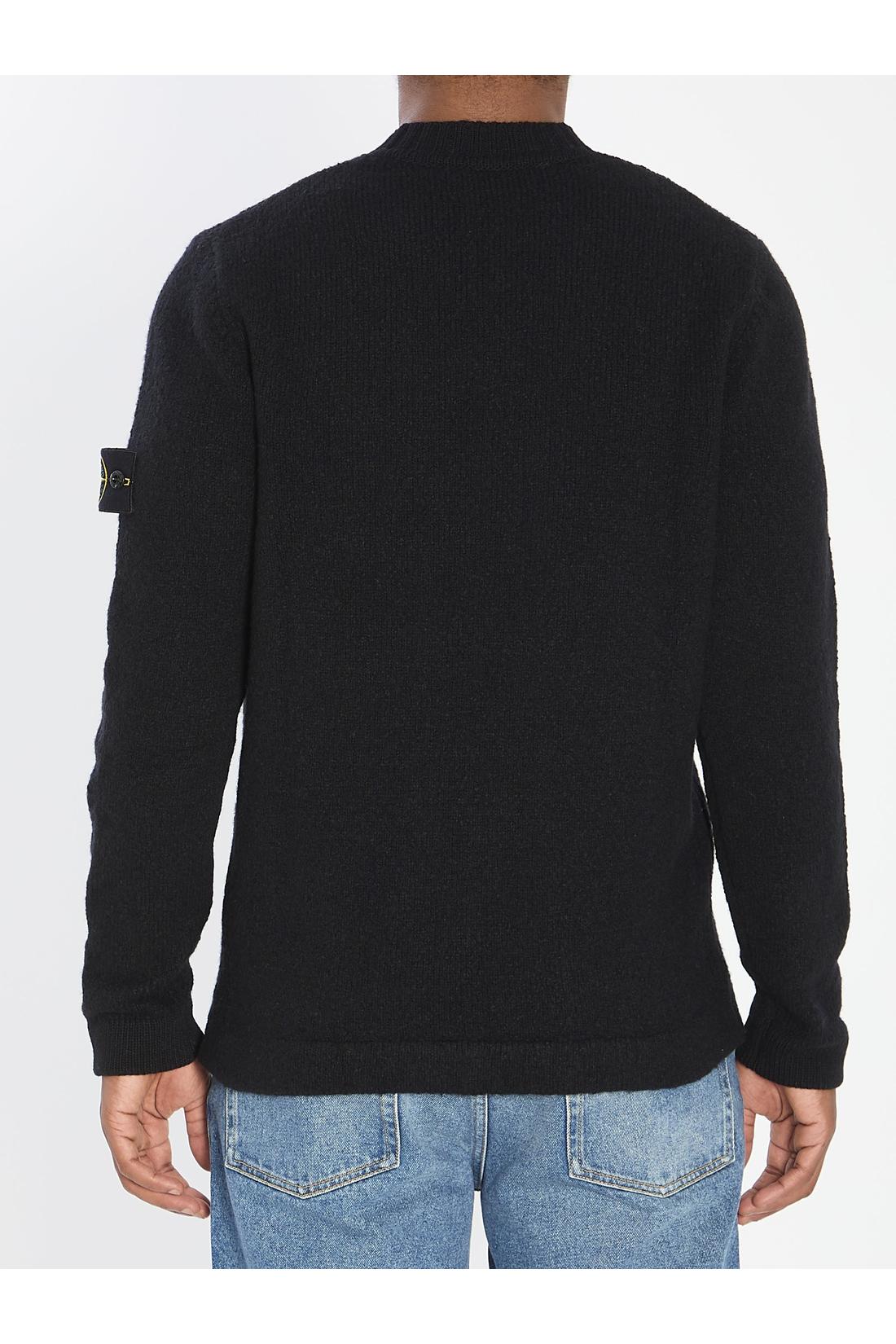 Crew neck sweater with brushed texture.