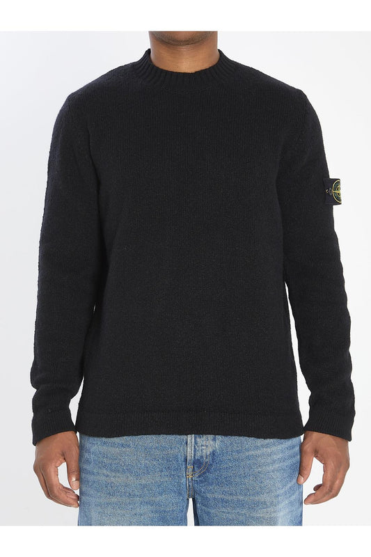 Crew neck sweater with brushed texture.